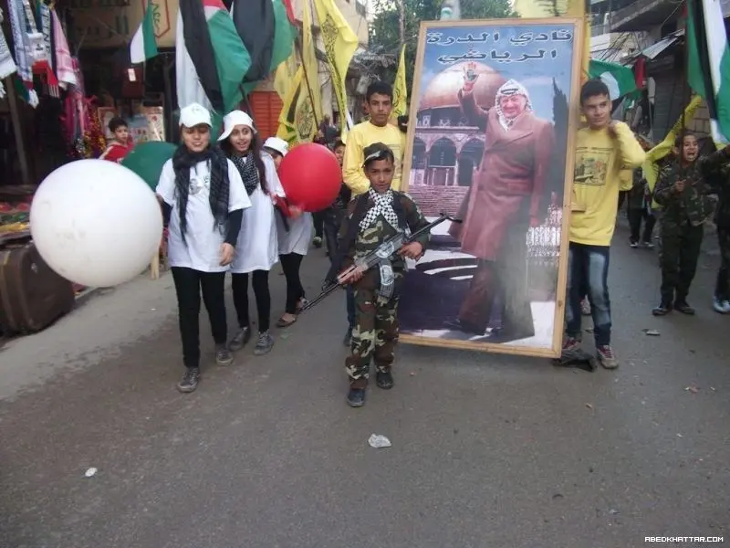 بالصور مسيرة انطلاقة حركة التحرير الوطني الفلسطيني فتح في مخيم البداوي